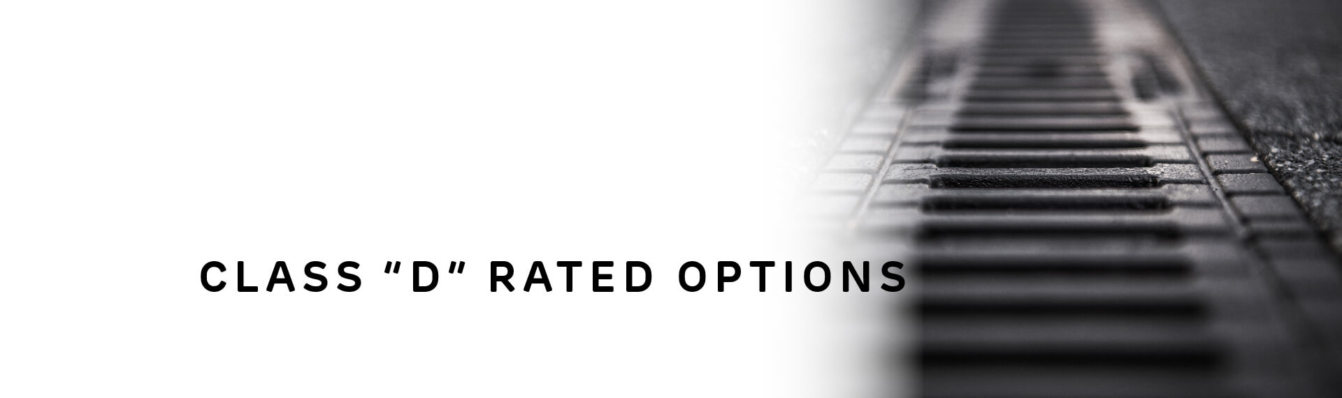 Header image with “Class D Rated Options” in capital letters; with a photo of a long, straight drainage channel grate. 