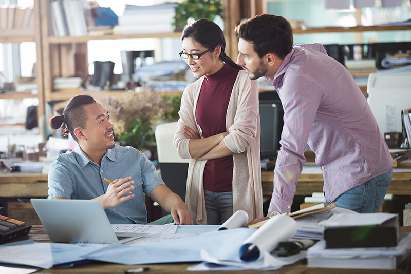 Architects talking in the office reduced