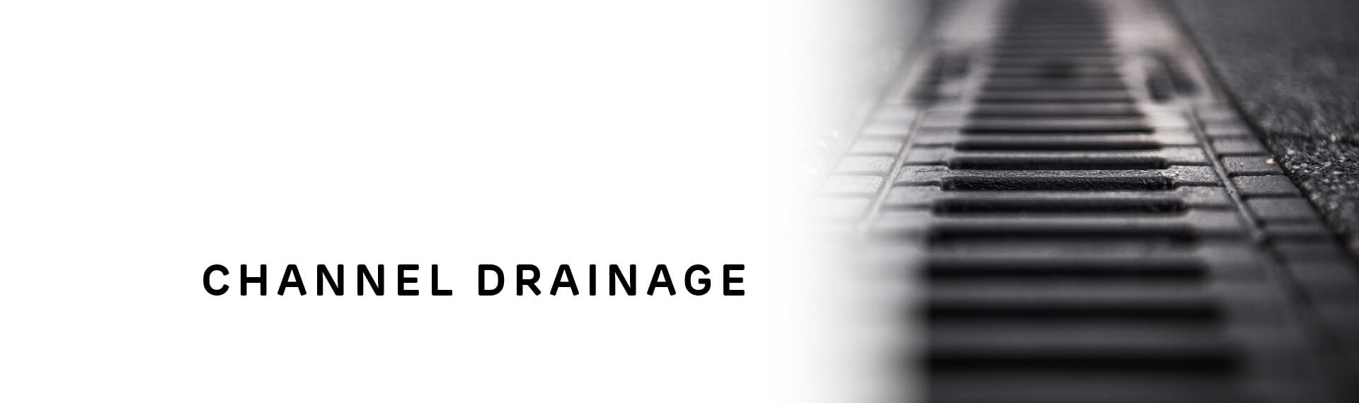 [Translate to Australia:] A mainly white header image with a close-up photo of a drainage grate shown on the right-hand side of the banner. The words “Leachate Solutions” are written in black font.