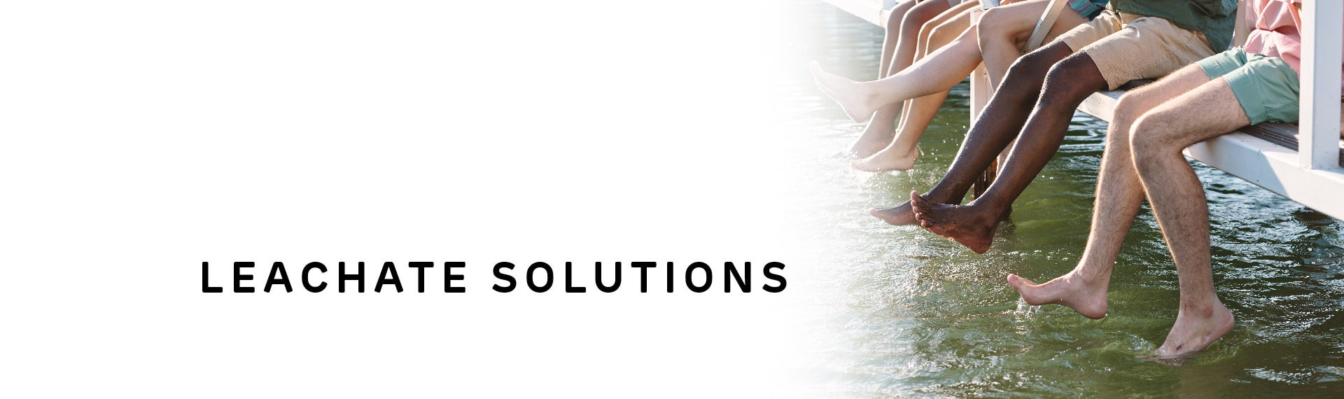 Header image with “Leachate Solutions” in capital letters; with a photo of a group of children swinging their legs in a lake while sitting on the dock. 